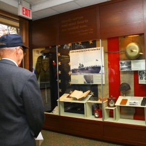 Veteran Willard "Bill" Norberg admires River Vale's display honoring the USS ENTERPRISE (CV-6)