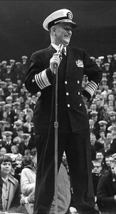 Chief of Naval Operations ADM Arleigh A. Burke, USN, addresses U.S. Naval Academy pep rally on 23 November 1960, on the eve of Army-Navy football game. NH 54900.