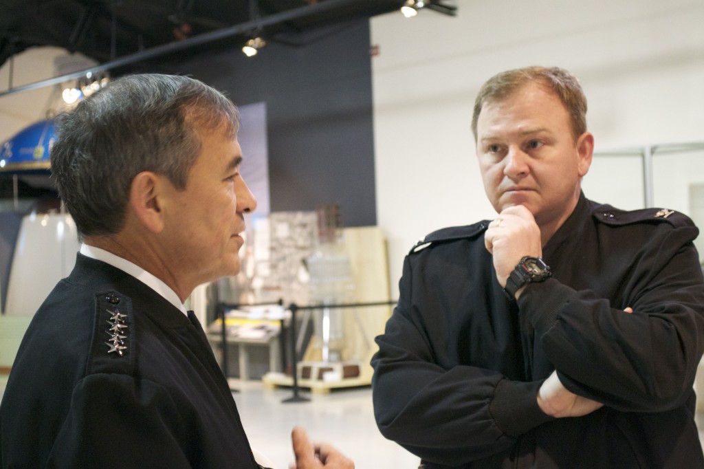 NHHC Director Captain Jerry Hendrix, USN talks with Admiral Harris inside the Cold War Gallery