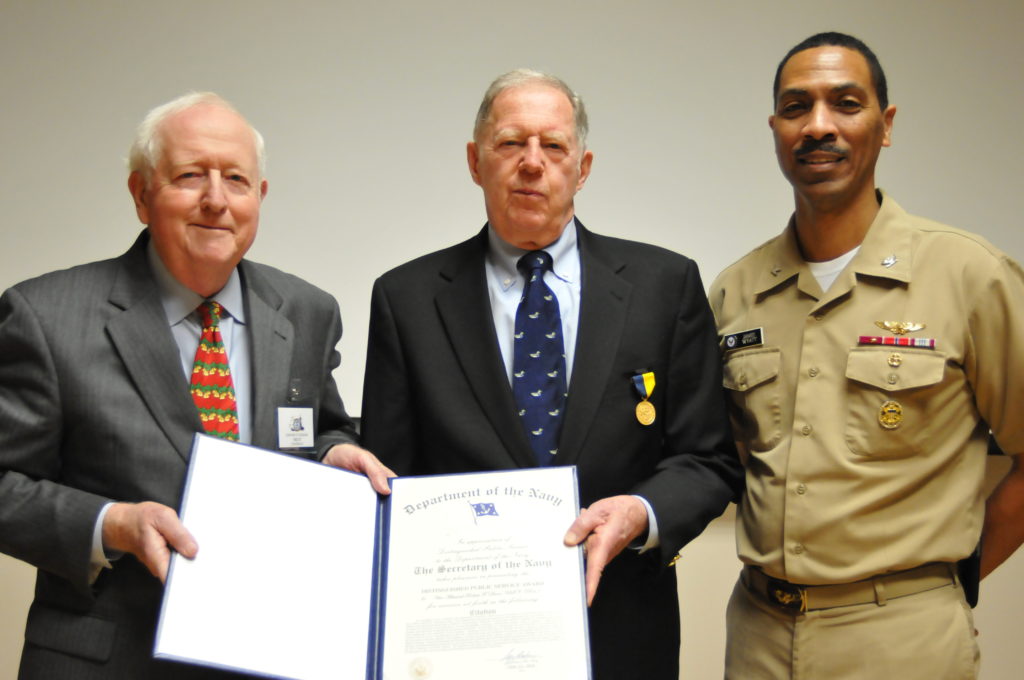 Chairman of the Naval Historical Foundation, Adm. Bruce DeMars, USN (Ret.) and Capt. James Wyatt, Deputy Director of the Navy Staff, present Vice Adm. Robert Dunn, USN (Ret.), center, with his Distinguished Public Service Award certificate at the National Museum of the U.S. Navy's Museum Education Center. Dunn received the award for his many efforts to promote the U.S. Navy's history throughout his 14 year tenure as president of the Naval Historical Foundation (NHF) from 1998-2012. (Photo by Mass Communication Specialist 1st Class Tim Comerford/Released)