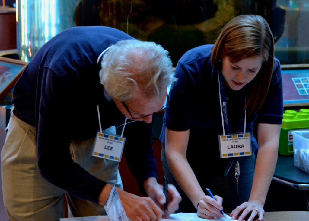 NORFOLK, VA (February 7, 2015) HRNM Deputy Educaiton Director Laura Orr works with HRNM ED Director Lee Duckworth sorting out volunteer lists on the morning of the event. (Photo by Matthew Eng/NHF/Released)