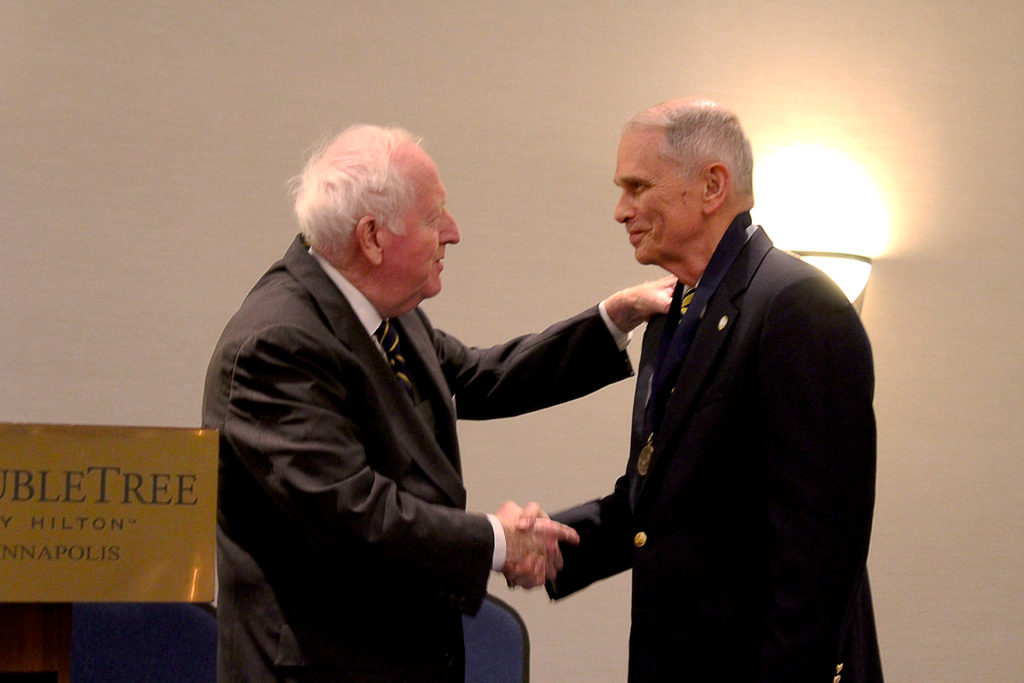 NHF Chairman Admiral Bruce DeMars, USN (Ret.) presents the Knox Medal to LCDR Thomas J. Cutler, USN (Ret.) at a banquet held on Friday evening. (NHF Photo by Matthew T. Eng/Released)