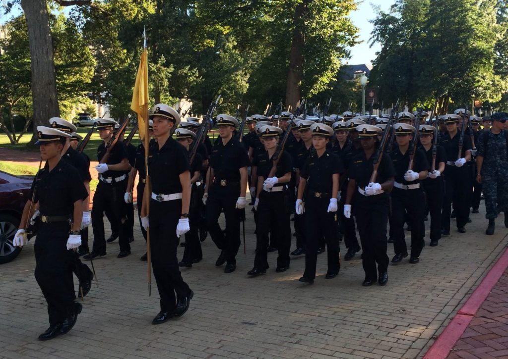 Midshipman march outside of a reception held at the Naval Academy Museum at the 2015 McMullen Naval History Symposium.