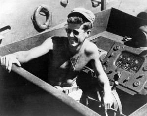 110529-O-ZZ999-007 FILE PHOTO (circa 1943) Lt.j.g. John F. Kennedy aboard the PT-109. (Photo courtesy the John F. Kennedy Presidential Library and Museum, Boston/Released)