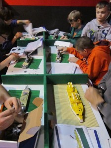 Visitors build LEGO ships designed by HRNM staff members for this year's event. (Photo by John Paulson/NHF/Released)