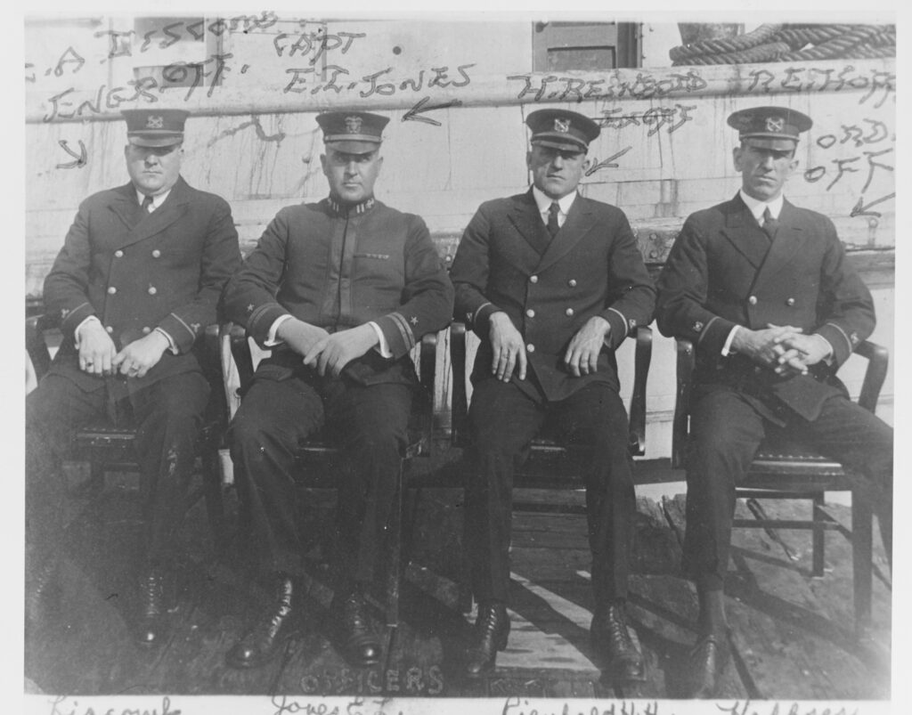 Ship's Officers at San Diego, California, circa early 1921. They are (from left to right): Machinist Louis A. Liscomb, Engineering Officer; Lieutenant Ernest L. Jones, Commanding Officer; Boatswain Harvey H. Reinbold, Executive Officer; and Boatswain Roy E. Hoffses, Ordnance Officer. All were lost when Conestoga disappeared after leaving San Diego in March 1921. Courtesy of W.P. Burbage, 1970. U.S. Naval History and Heritage Command Photograph. Related Content 