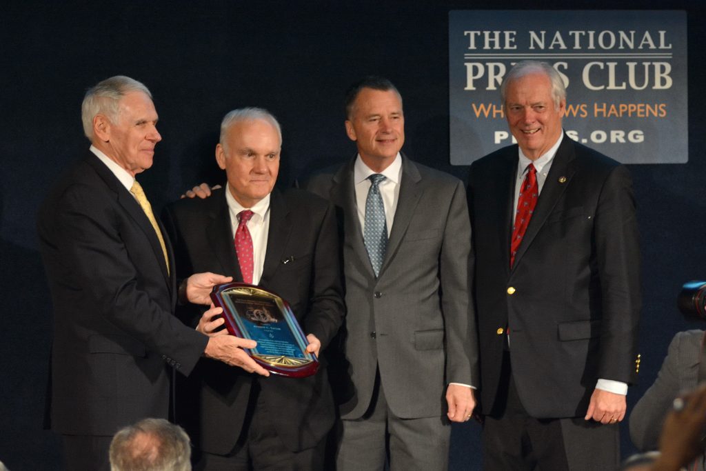 Enterprise Holdings Executive Chairman Andy C. Taylor accepts the NHF Distinguished Service alongside NHF Chairman Admiral William J. Fallon, USN (Ret.), Admiral Sandy Winnefeld, USN (Ret.), and Gary Jobson. (Photo courtesy Joe Rudinec/Rudinec and Associates/Released)