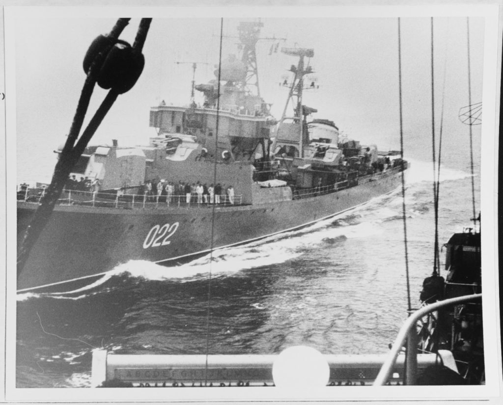 The Soviet "Kotlin"-class destroyer BESSLEDNYI (pennant number 022, at left), seen from the deck of the American destroyer USS WALKER (DD-517), was photographed by a U.S. Navy cameraman a short time before the two ships collided in the Sea of Japan during the morning of 10 May 1967. (NHHC Photo # K-36401)