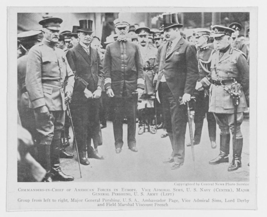 This image was originally taken on 8 June 1917, upon Pershing's arrival.  Note that he arrived in three star status and Sims is standing in the uniform he had made which features two stars.  Pershing was two years junior to Sims by lineal precedence, but received his promotion to four stars while Sims received his promotion in July to three stars (with the promotion back dated to May according to the register).  In essence, Pershing always outranked Sims as the AEF commander, but Sims held the chair as senior naval representative on the Allied Naval Council in London.  (NHHC Photo # NH 52790)