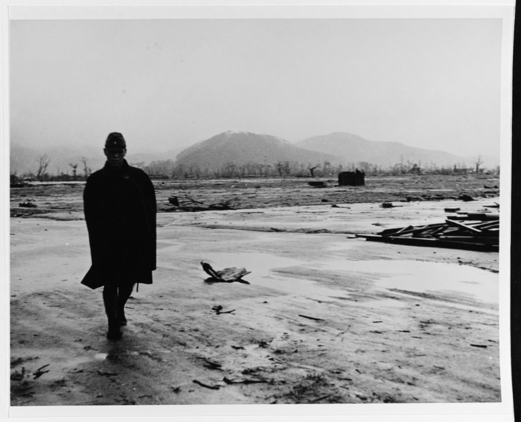 A Japanese soldier walks through the atomic-bomb leveled city, September 1945. Photographed by Lieutenant Wayne Miller, USNR. (Photo # 80-G-473733)