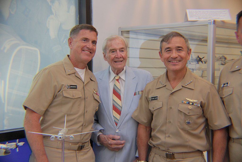 Admiral Harry Harris, PACOM, Admiral Bill Moran, VCNO (both Maritime Patrol Aviators), and model project coordinator Captain Ted Bronson, USN (Ret.) stand before the newly placed P-8A Poseidon Model (NHF Photo/Matthew Eng/Released)
