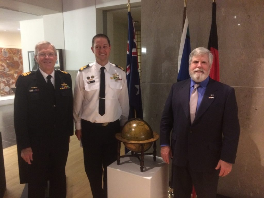 Australian Naval Attaché Commodore Peter Leavy helped NHF coordinate this special ceremony and donation. Pictured with the globe is Bollinger (right) with Leavy (middle) and RADM Steve Gilmore, Defense Attaché (left). (NHF Photo by Charles T. Creekman)